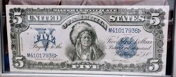 giant display of USA money from 1899 and 1901
